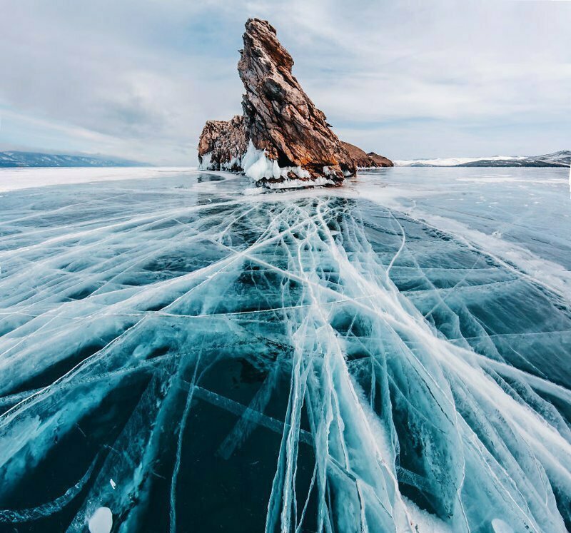 Washing laundry in ice holes and snowy weather