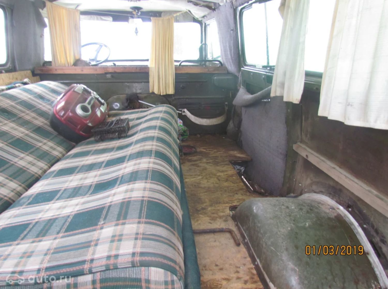 Old UAZ 452 interior with bed